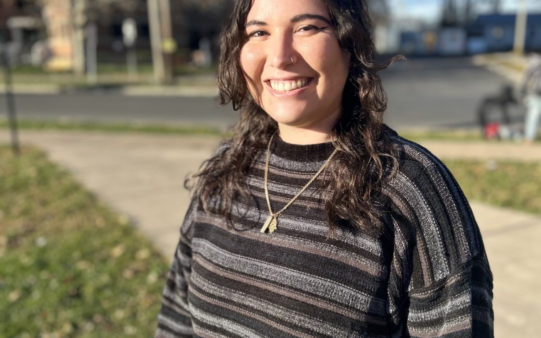 Smiling photo of Chloe Cabrera in the sunshine